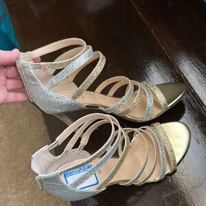 Elegant Gold and Silver Strappy Sandals by Guess